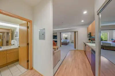 a kitchen with a living room and a bedroom at Palisades Tahoe Lodge Rentals Studio #158 in Olympic Valley
