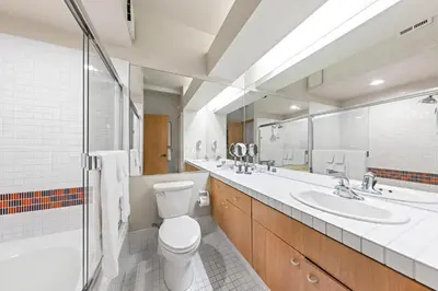 a bathroom with a toilet and a sink and a shower at Palisades Tahoe Lodge Rentals Studio #215 in Olympic Valley