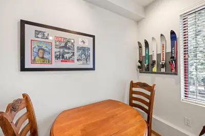 a dining room with a wooden table and chairs at Palisades Tahoe Lodge Rentals Studio #248 in Olympic Valley