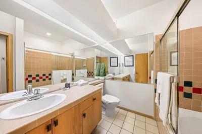a bathroom with a sink and a toilet and a shower at Palisades Tahoe Lodge Rentals Studio #248 in Olympic Valley