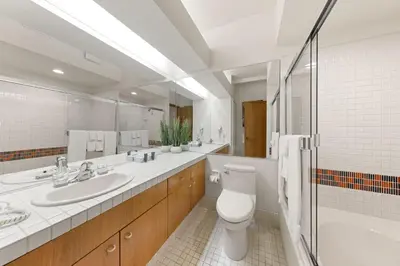 a bathroom with a toilet and a sink and a shower at Palisades Tahoe Lodge Rentals Studio #228 in Olympic Valley