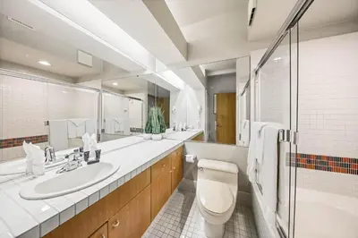 a bathroom with a toilet and a sink and a tub at Palisades Tahoe Lodge Rentals Studio #237 in Olympic Valley