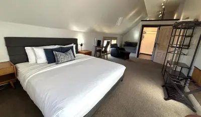 a bedroom with a large white bed in a room at Tahoe Star Hotel in Truckee