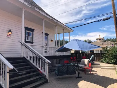 a patio with a table and an umbrella at Tahoe Star Hotel in Truckee
