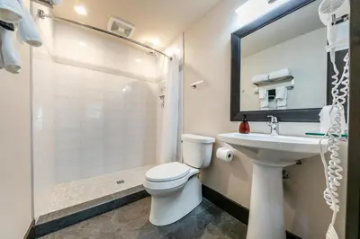 a bathroom with a toilet and a sink and a shower at Tahoe Star Hotel in Truckee
