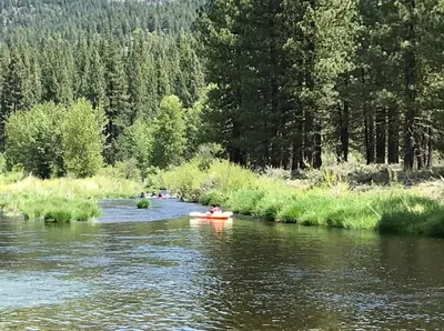 a group of people kayaking down a river at Tahoe Star Hotel in Truckee