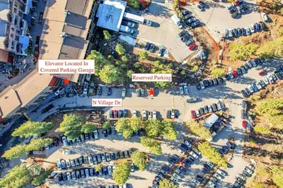 an aerial view of a parking lot with parked cars at Slope Side Studio in Northstar Village! in Truckee