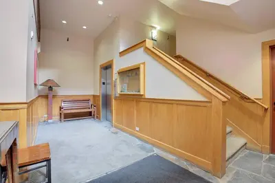 a hallway with a staircase in a building at Slope Side Studio in Northstar Village! in Truckee