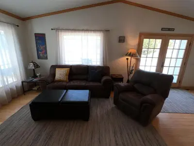 a living room with two couches and a coffee table at Rr-johnson Suite in June Lake