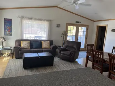 a living room with a couch and chairs and a table at Rr-johnson Suite in June Lake