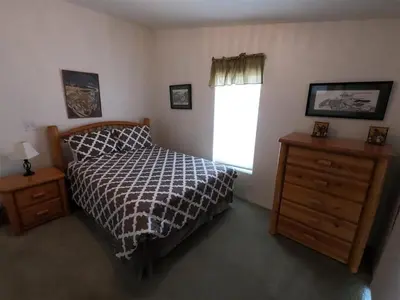 a bedroom with a bed and a window and a dresser at Rr-kenton Hs in June Lake