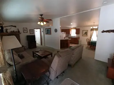 a living room with a couch and a table at Rr-kenton Hs in June Lake