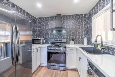 a kitchen with a stove and a sink at Reno Serenade: 3-Bed Urban Sanctuary in Reno