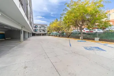 an empty sidewalk in front of a building at Stylish-Serene Midtown Getaway: Retreat for Two in Reno