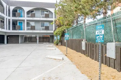 a parking lot in front of a building at Midtown Getaway: Trendy Studio Heart of Reno in Reno