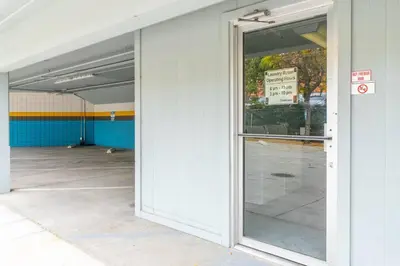 an open glass door of a parking garage at Midtown Getaway: Trendy Studio Heart of Reno in Reno