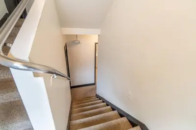 a staircase in a building with a stair case at Riverside Glam: Stylish Urban Escape in Reno