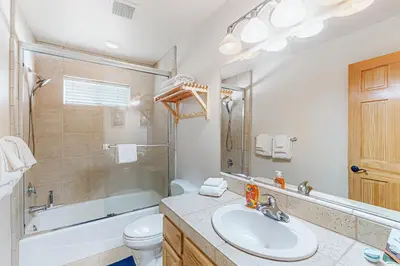 a bathroom with a sink and a tub and a toilet at Rooftop Retreat in South Lake Tahoe