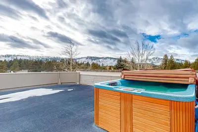 a hot tub on the roof of a house at Rooftop Retreat in South Lake Tahoe