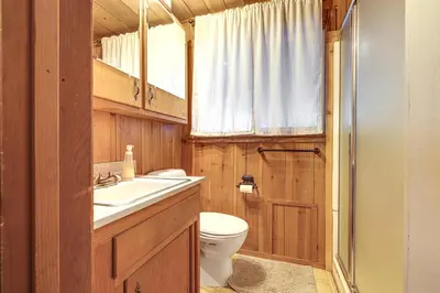 a bathroom with a toilet and a sink at Cozy Mi-Wuk Village Cabin 18 Mi to Dodge Ridge! in Mi-Wuk Village