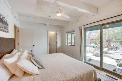 a bedroom with a bed and a large window at 6 Mi to Slopes Mtn-View Retreat in Lake Tahoe in South Lake Tahoe