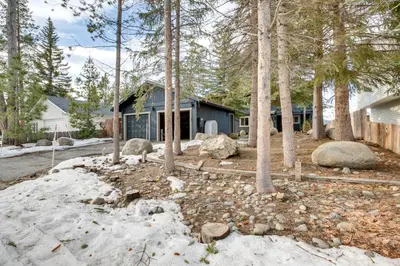 a house in the woods with snow and trees at 6 Mi to Slopes Mtn-View Retreat in Lake Tahoe in South Lake Tahoe