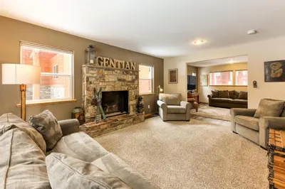 a living room with a couch and a fireplace at Gentian Family Retreat in South Lake Tahoe