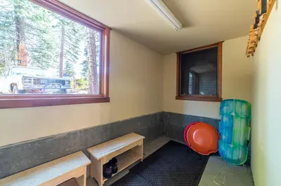 a room with a bench and a window at Luxury home close to Village; Garage & Jacuzzi in Mammoth Lakes