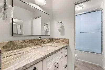 a bathroom with a sink and a mirror at Luxury at Altitude – Base Camp 2 Bedroom condo in Kirkwood