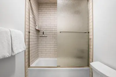 a shower with a glass door in a bathroom at Luxury at Altitude – Base Camp 2 Bedroom condo in Kirkwood