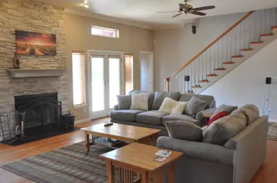 a living room with a couch and a fireplace at Master Suite Fraser Family Vineyard Stay in Amador in Plymouth