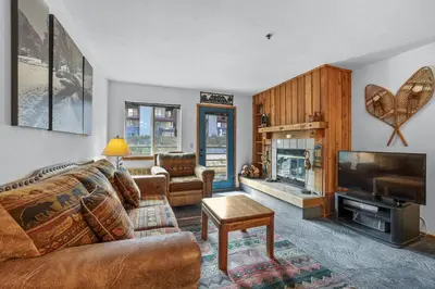 a living room with a couch and a fireplace at Cozy Kirkwood Condo – The Meadows 2 Bedroom condo in Kirkwood