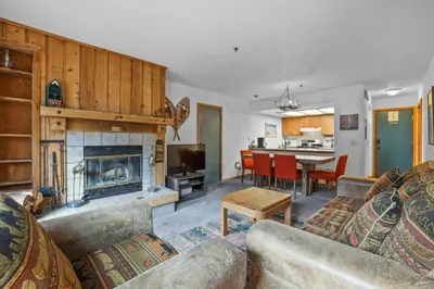 a living room with a couch and a fireplace at Cozy Kirkwood Condo – The Meadows 2 Bedroom condo in Kirkwood