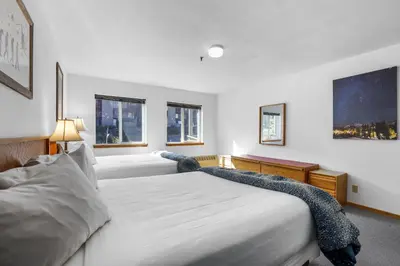 a hotel room with two beds and two windows at Cozy Kirkwood Condo – The Meadows 2 Bedroom condo in Kirkwood