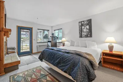 a bedroom with a bed and a tv in it at Cozy Kirkwood Condo – The Meadows 2 Bedroom condo in Kirkwood