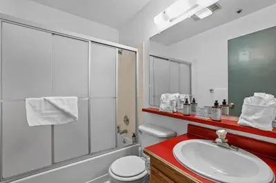 a bathroom with a toilet and a sink and a shower at Cozy Kirkwood Condo – The Meadows 2 Bedroom condo in Kirkwood