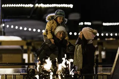 a man holding a child on his shoulders at Cozy Kirkwood Condo – The Meadows 2 Bedroom condo in Kirkwood