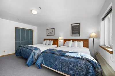 a bedroom with two beds and a window at Cozy Kirkwood Condo – The Meadows 2 Bedroom condo in Kirkwood