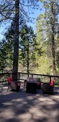 a group of benches and a table in a park at Mountain Life On Deck in Arnold
