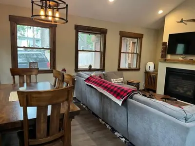 a living room with a couch and a table at Cabin in the Woods in Tahoe Vista