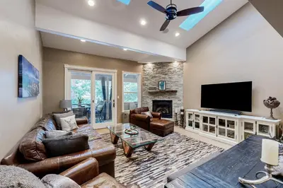 a living room with a couch and a tv at High Sierra Haven in Incline Village