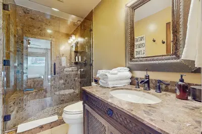 a bathroom with a sink and a toilet and a shower at High Sierra Haven in Incline Village