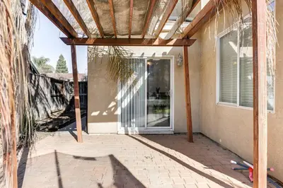 an entrance to a house with a glass door at Spacious Turlock Home about 1 Mi to University! in Turlock