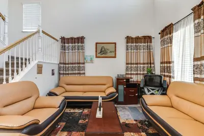 a living room with two couches and a tv at Spacious Turlock Home about 1 Mi to University! in Turlock