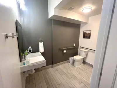 a bathroom with a sink and a toilet at Wofford Village Studios in Wofford Heights