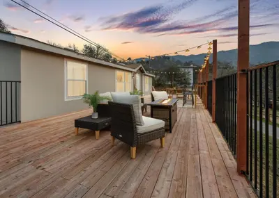 a deck with chairs and a table on a house at 4 Miles to Sequoia NTL Park in Three Rivers