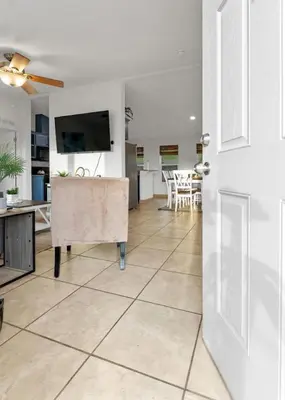 a living room with a television and a tiled floor at 4 Miles to Sequoia NTL Park in Three Rivers