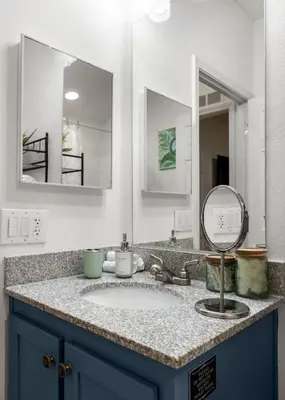 a bathroom counter with a sink and two mirrors at 4 Miles to Sequoia NTL Park in Three Rivers