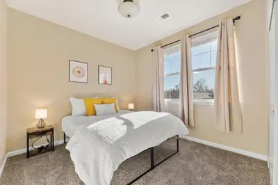a bedroom with a bed and a window at MidTown Hideaway Fire Pit and King Beds in Reno