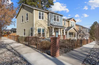 a house with a wrought iron fence at MidTown Hideaway Fire Pit and King Beds in Reno